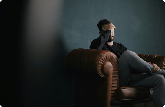 Image of man sitting on a couch